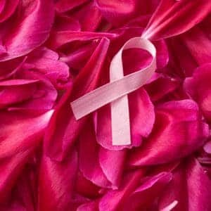 A pink ribbon incorporated with pink tulips represents breast cancer awareness.